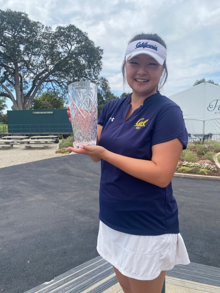 Kaylyn Noh posing for the camera while holding the glass 1st place trophy after winning the Sacramento Valley Women's Amateur Championship.