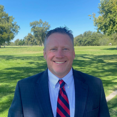 Photo of AJ Salvetti with golf course background